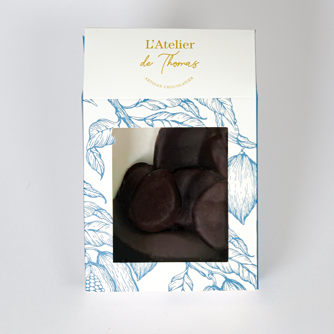 Sachet de gingembrettes artisanales de L’Atelier de Thomas – écorces de gingembre confites enrobées de chocolat noir 66 %.