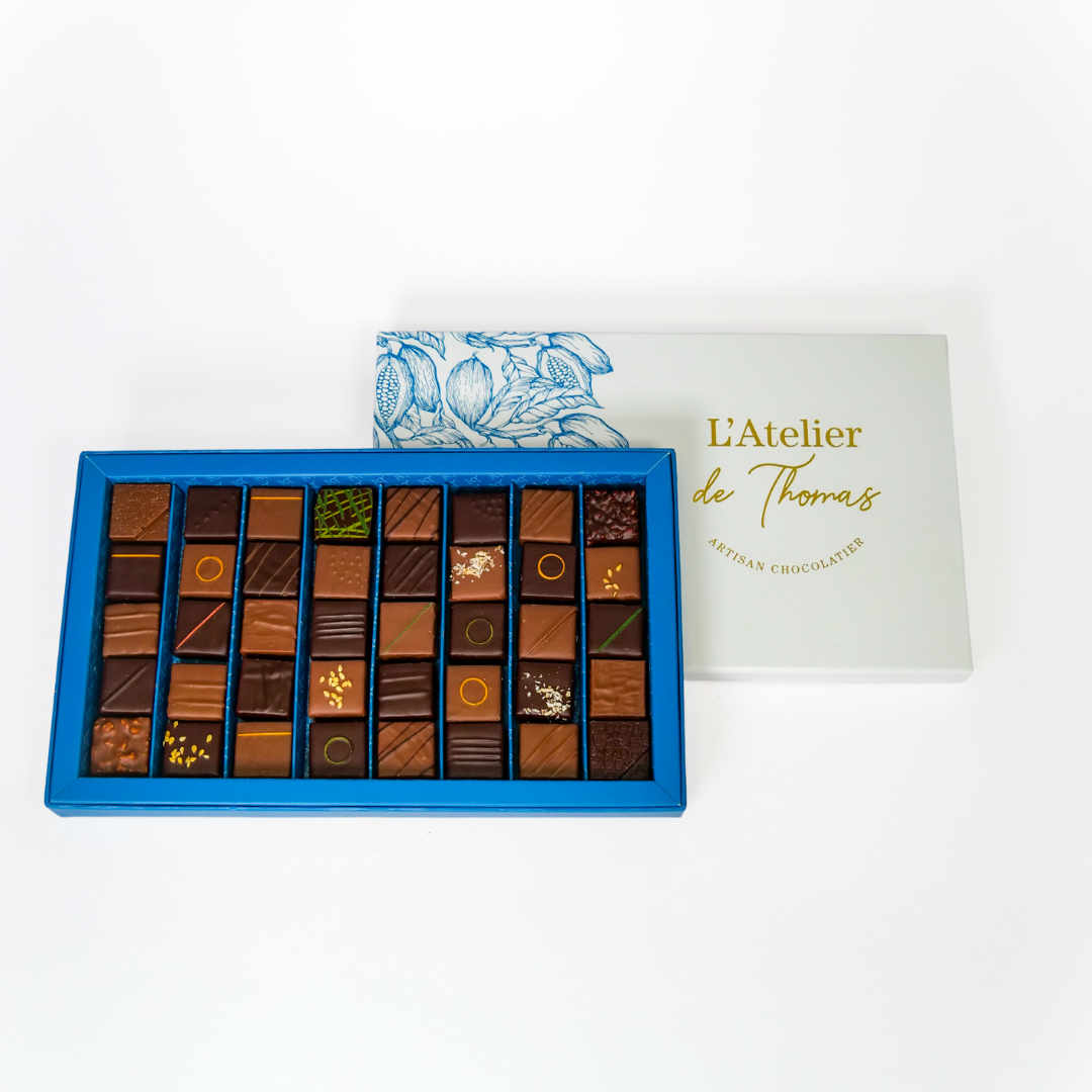 Grande boîte de 300 g de chocolats assortis artisanaux de L’Atelier de Thomas.